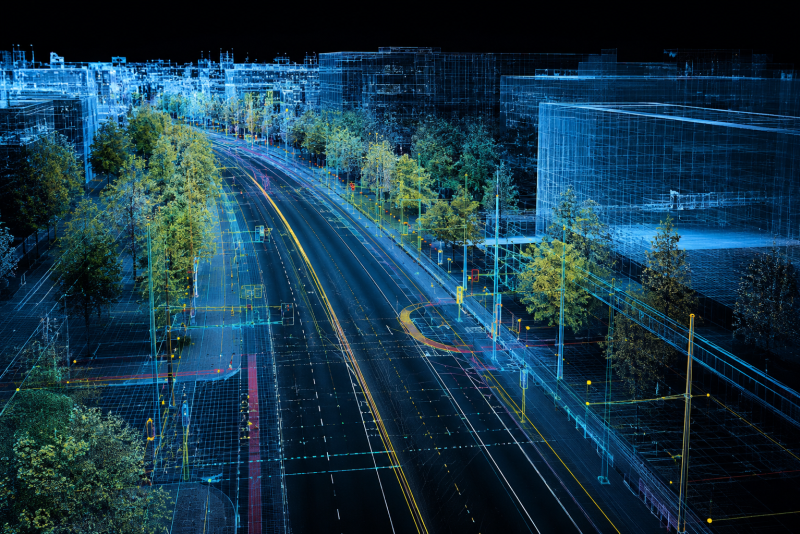 Eine digitale Stadt, feine blaue Linien zeichnen die verschiedensten Geb&auml;ude auf schwarzen Hintergrund